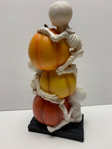 Stacked Skeletons and pumpkins